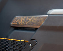 Load image into Gallery viewer, Bronco Topo Front Door Grab Handle Overlay 2021–2025 | Topography Pattern Vinyl Wrap Interior Trim Decal overlay 2021+ Ford Bronco